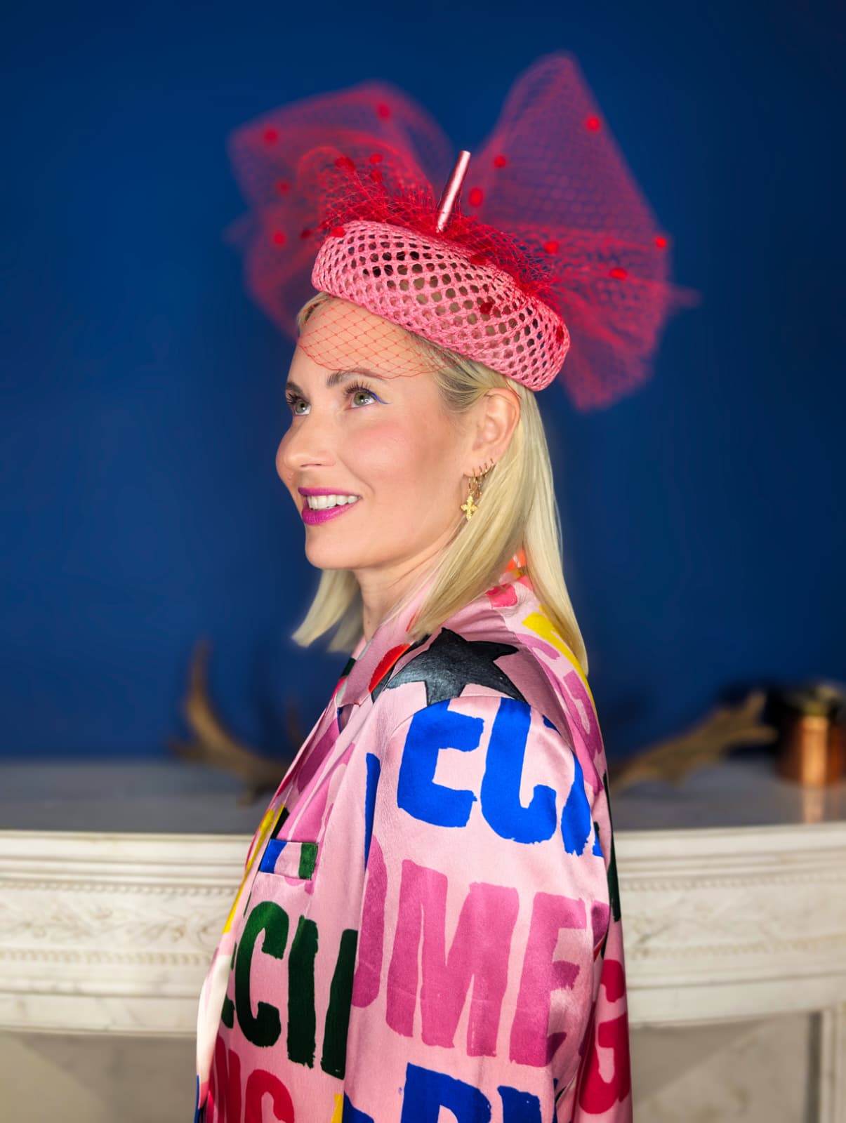 Lou Kubicki wearing a pink veiled pillbox headpiece